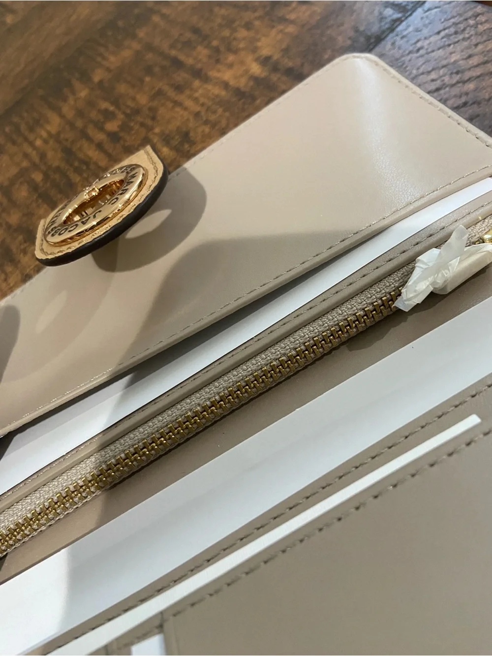 Marc Jacobs Signet Turnlock Slim Wallet in the Color Iced Coffee